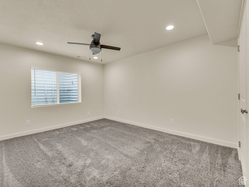 Unfurnished room with a ceiling fan, baseboards, carpet flooring, and recessed lighting