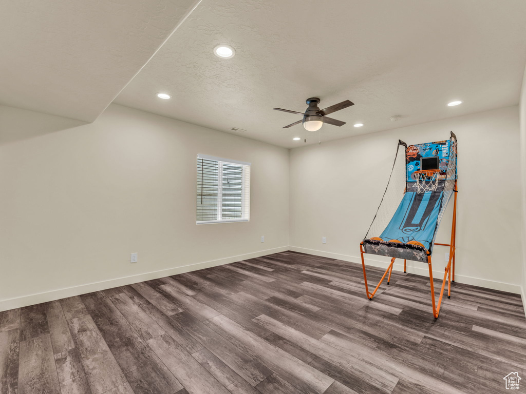 Unfurnished bedroom featuring recessed lighting, dark wood finished floors, baseboards, and ceiling fan