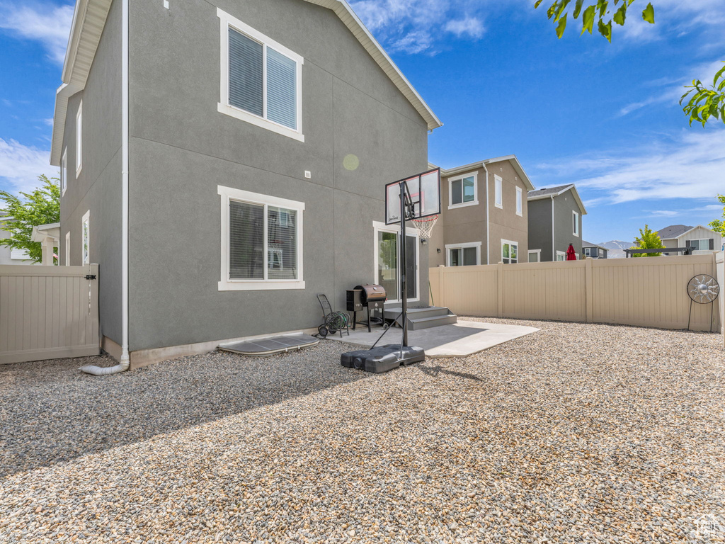 Back of property featuring a patio area and stucco siding