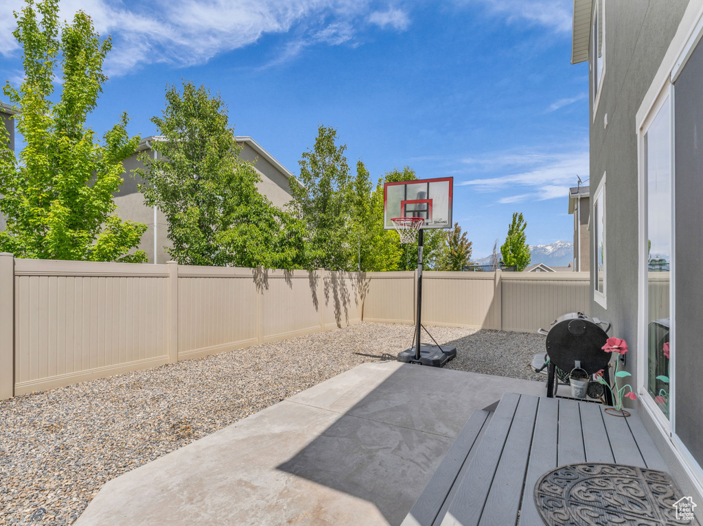 Fenced backyard with a patio