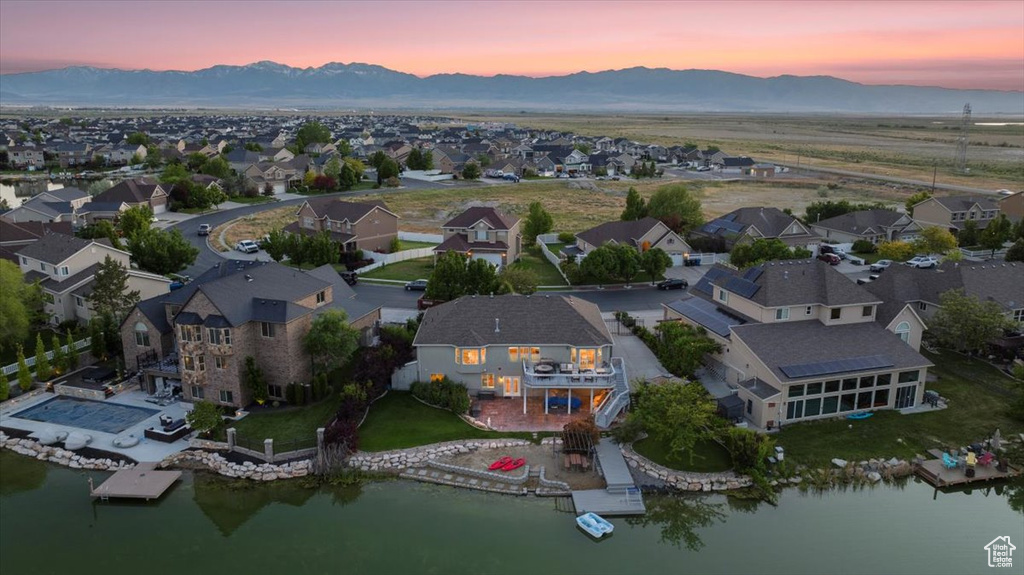 Aerial perspective of suburban area featuring a water and mountain view