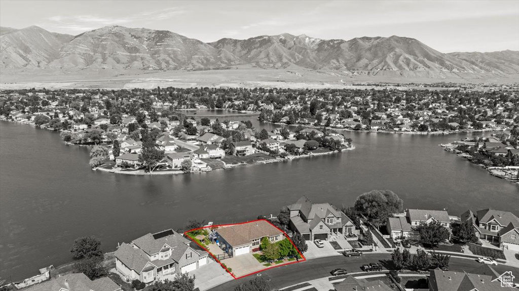 Aerial perspective of suburban area featuring a water and mountain view and property boundaries highlighted
