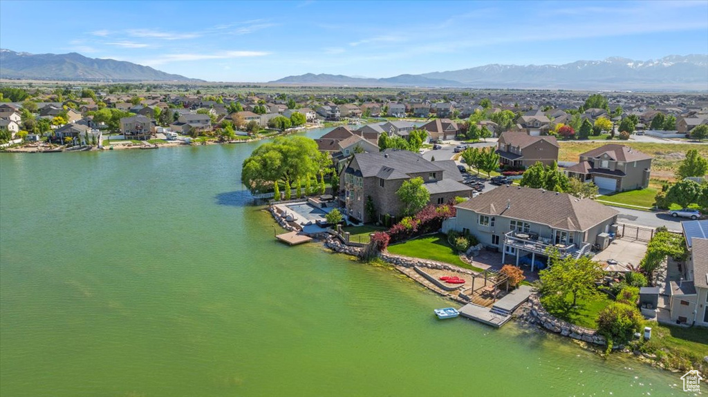 Aerial perspective of suburban area with a water and mountain view