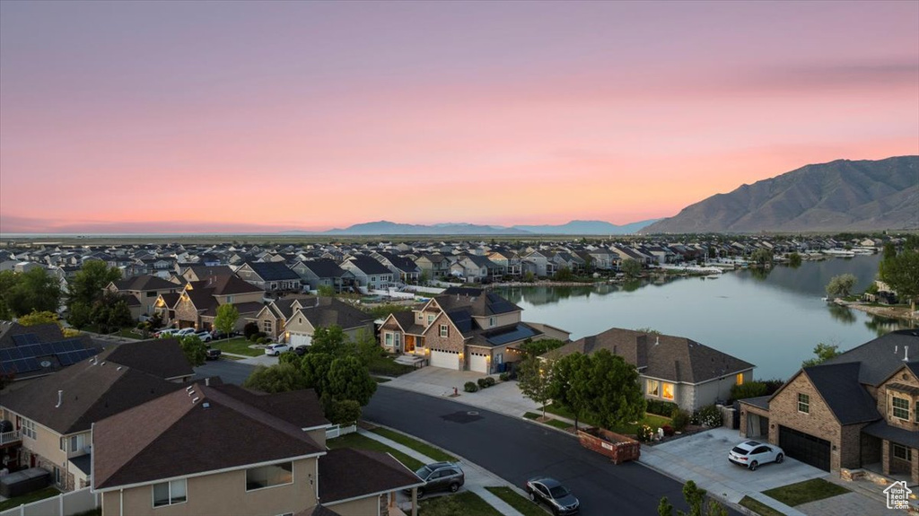 Aerial perspective of suburban area with a water and mountain view