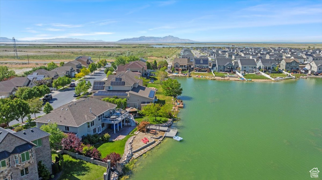 Aerial perspective of suburban area with a water and mountain view