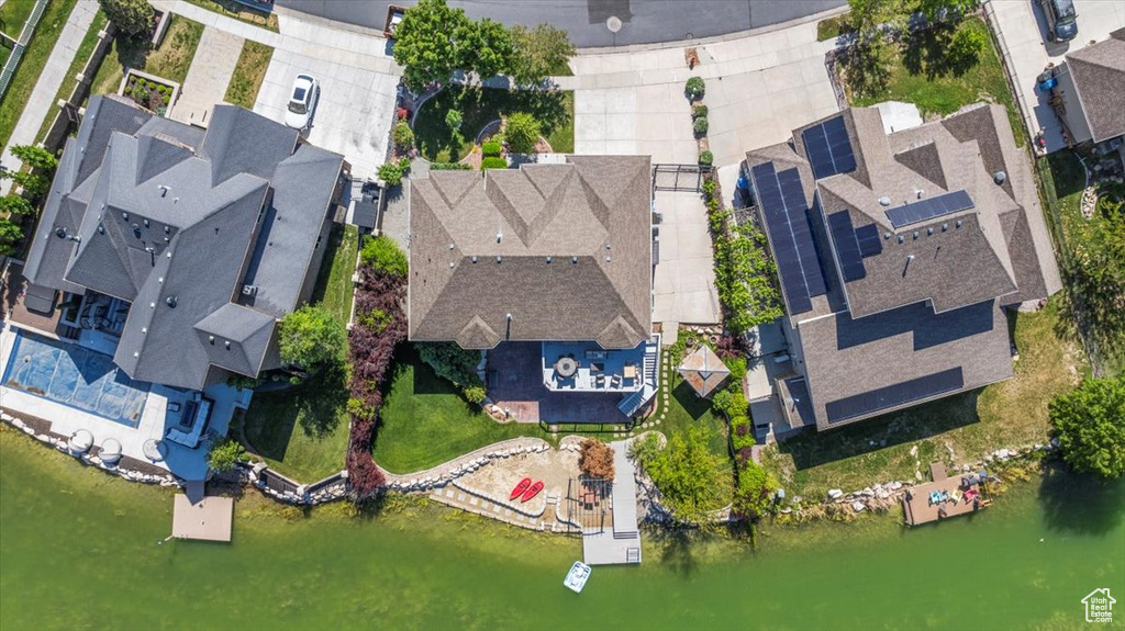 Aerial perspective of suburban area with a large body of water