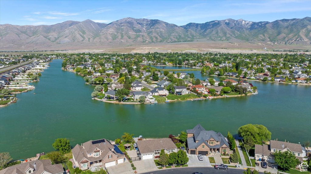 Aerial view of residential area featuring a water and mountain view