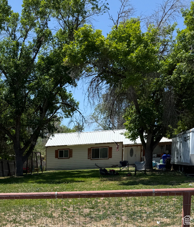 View of front of property featuring metal roof