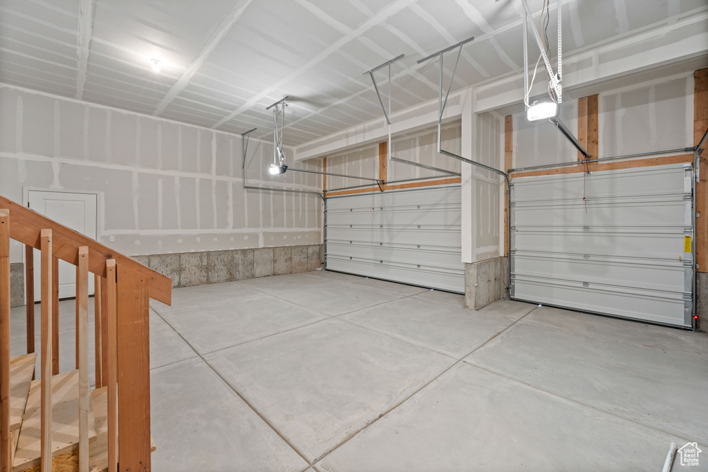 Garage featuring a garage door opener