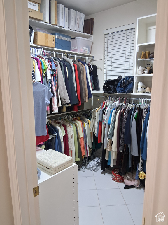 Spacious closet featuring tile patterned floors