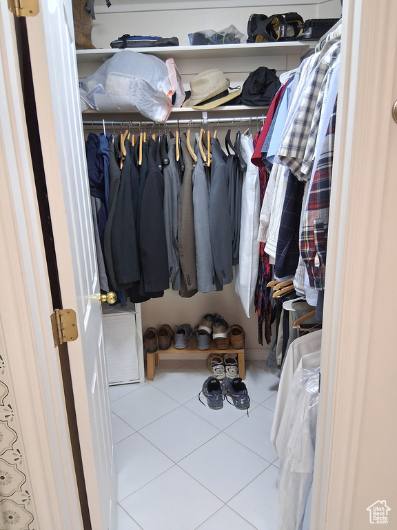 Spacious closet featuring tile patterned floors