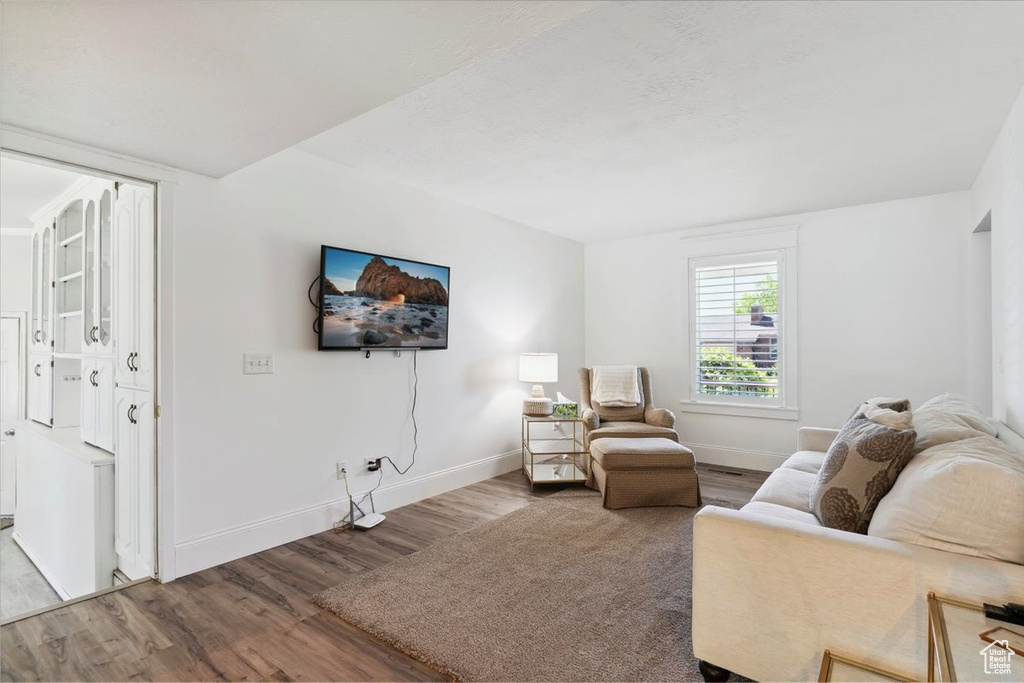 Living room featuring wood finished floors and baseboards