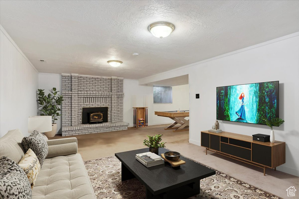 Living room with light carpet, a textured ceiling, crown molding, and a fireplace