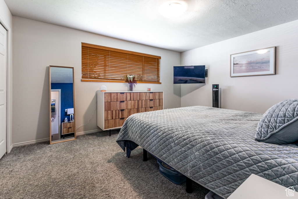 Bedroom with carpet and baseboards