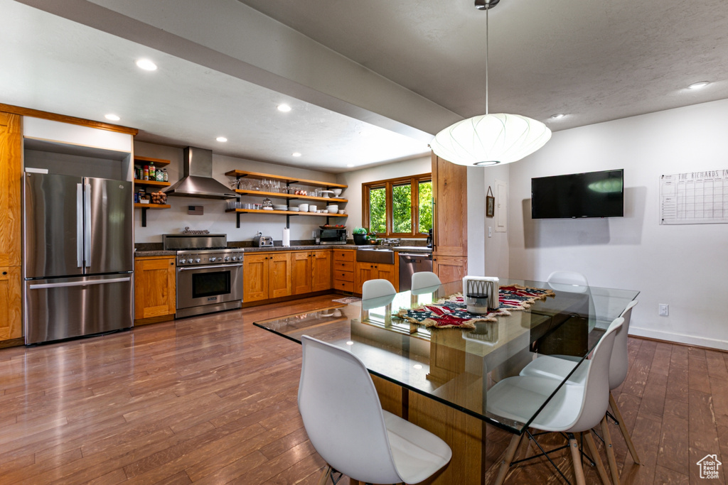 Dining room featuring dark wood-style floors, recessed lighting, and baseboards