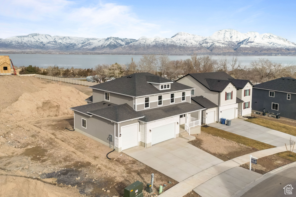 View from above of property featuring a water and mountain view
