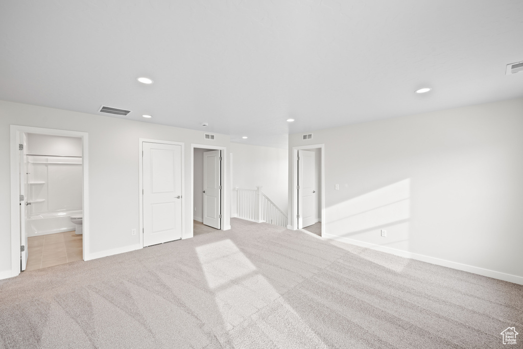 Spare room with carpet floors, recessed lighting, and baseboards