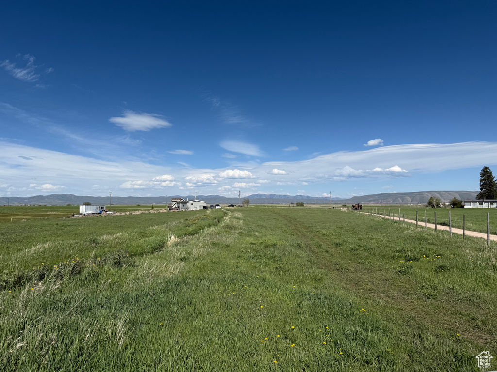 View of yard with a rural view