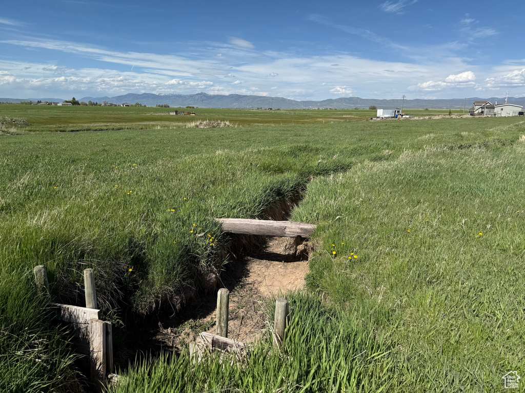 View of yard with a view of countryside and a mountain view