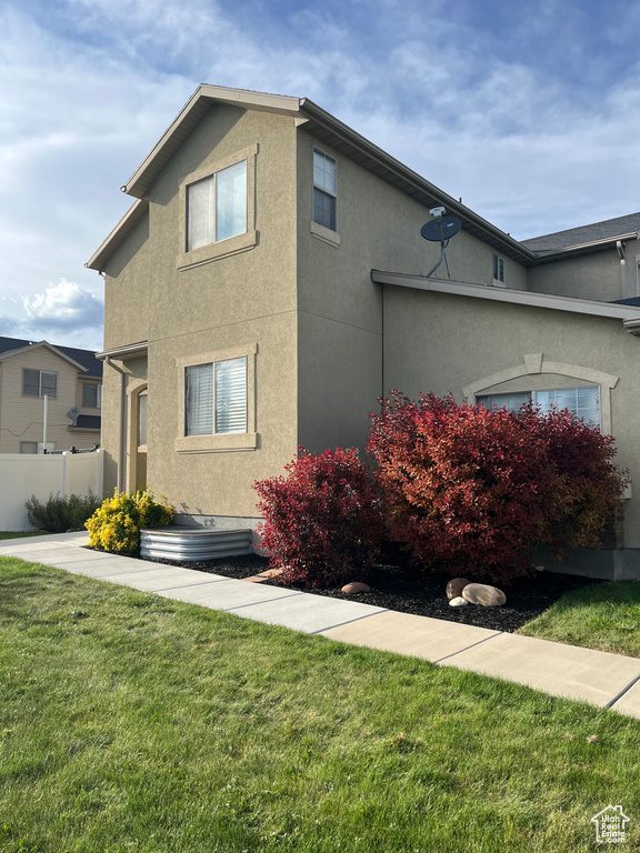 View of home\'s exterior with stucco siding
