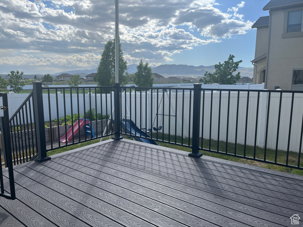 Wooden terrace featuring a mountain view