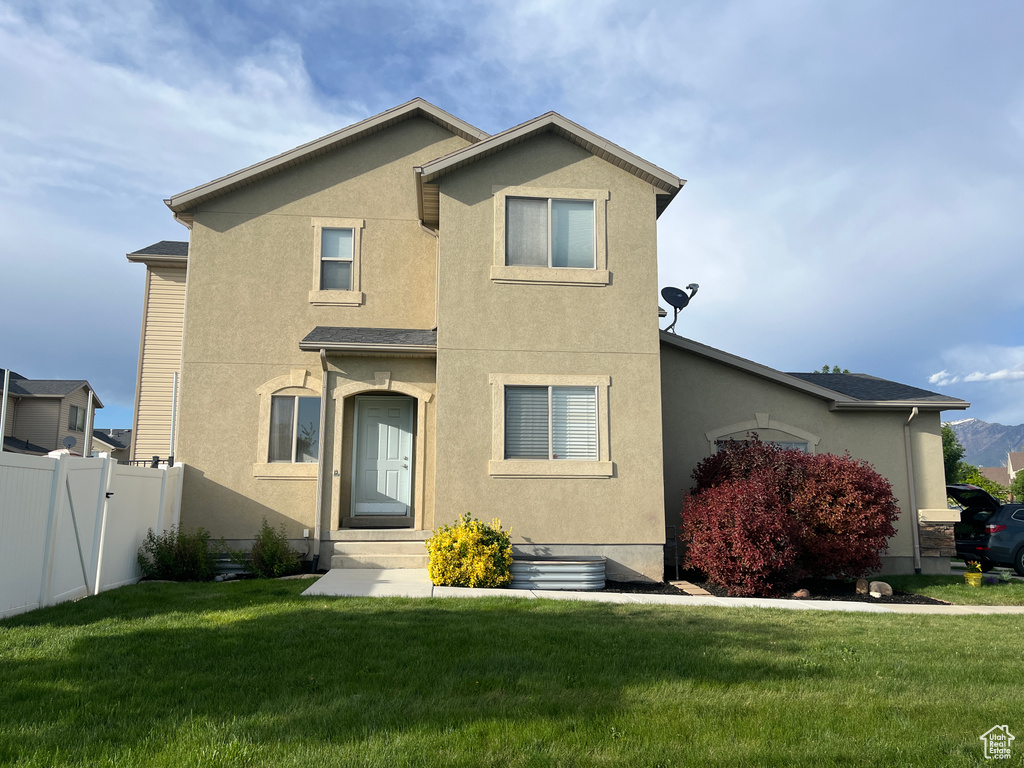 View of front of house featuring stucco siding