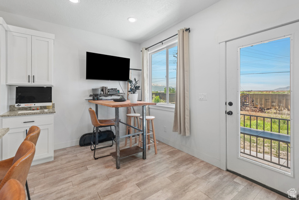 Home office featuring light wood-type flooring, recessed lighting, and baseboards
