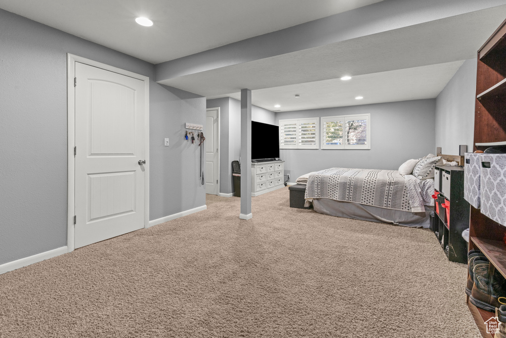 Carpeted bedroom featuring recessed lighting and baseboards