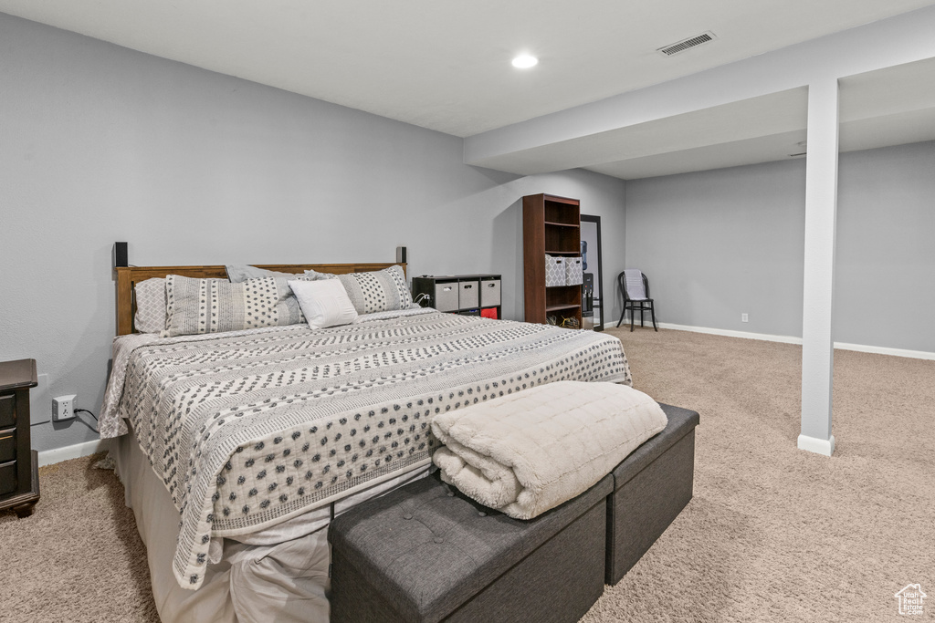 Carpeted bedroom featuring baseboards and recessed lighting