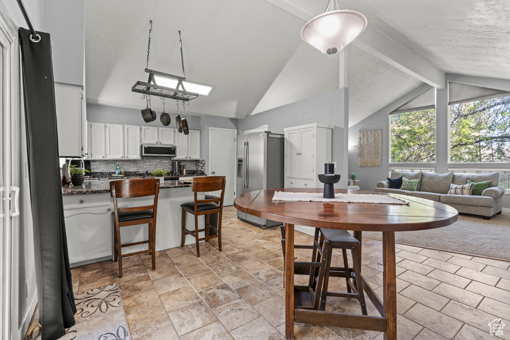 Dining room with stone tile floors