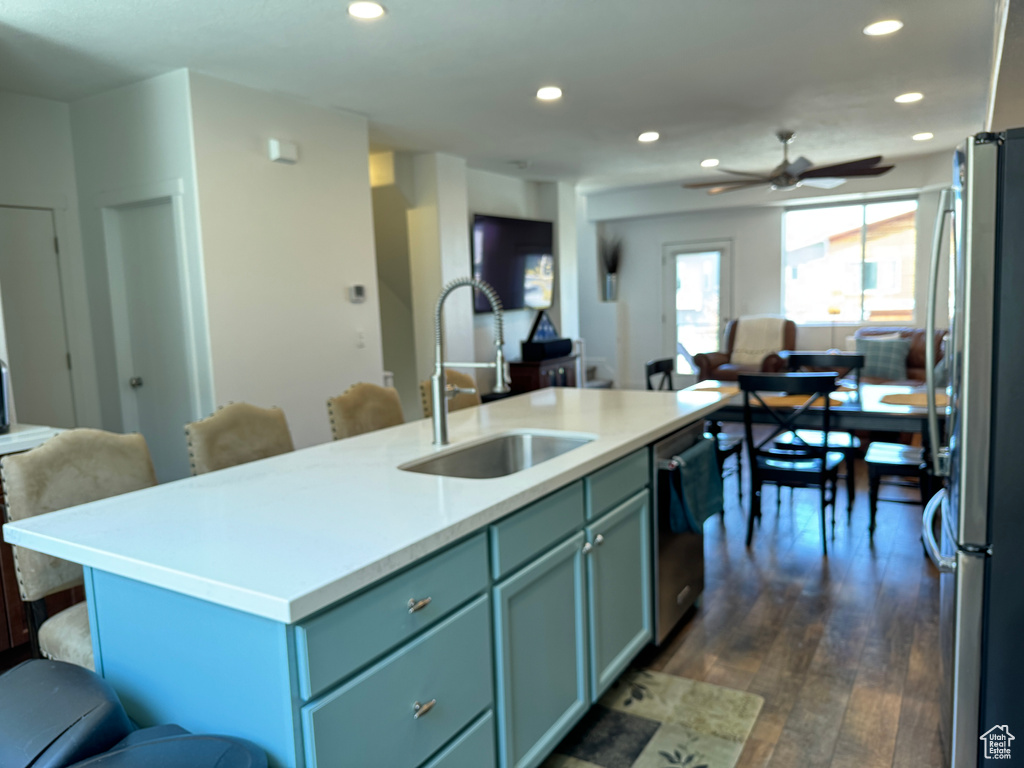 Kitchen with open floor plan, a sink, appliances with stainless steel finishes, recessed lighting, and ceiling fan