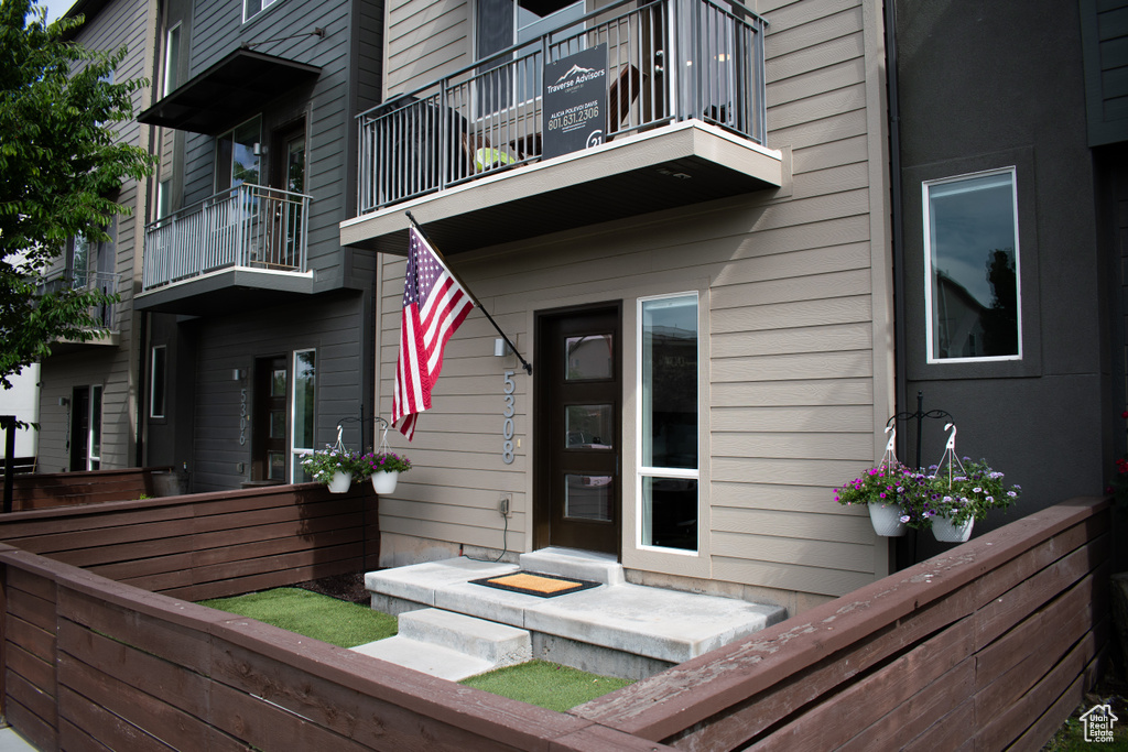 Doorway to property with a balcony