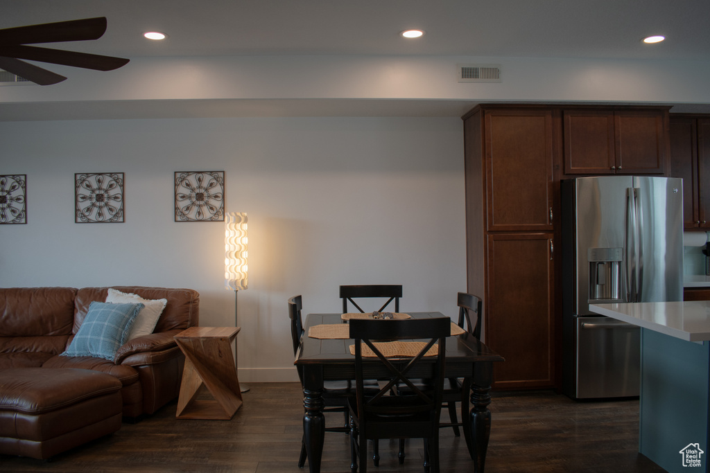 Dining area featuring ceiling fan, dark wood-style flooring, and recessed lighting