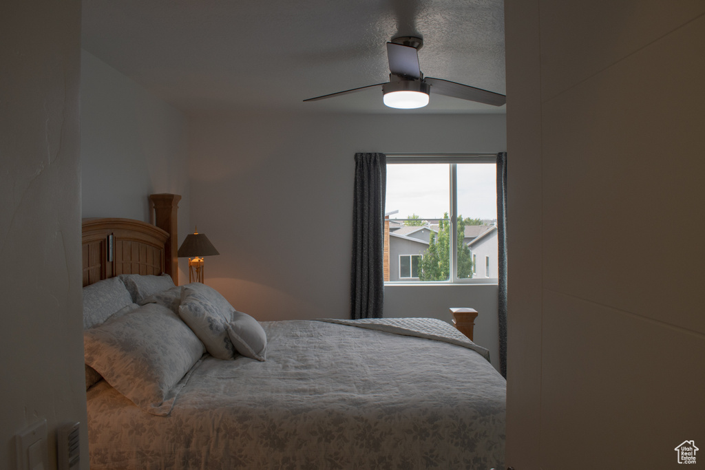 Bedroom featuring a ceiling fan