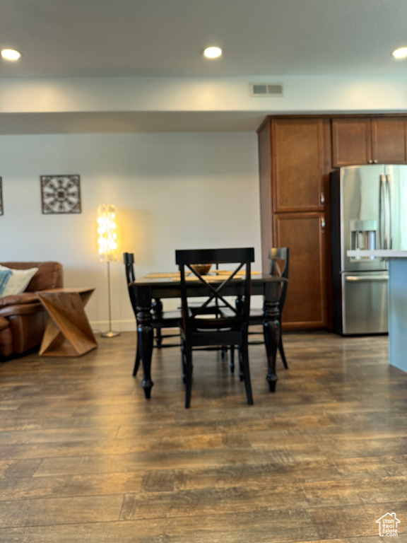 Dining room featuring recessed lighting, dark wood-type flooring, and baseboards