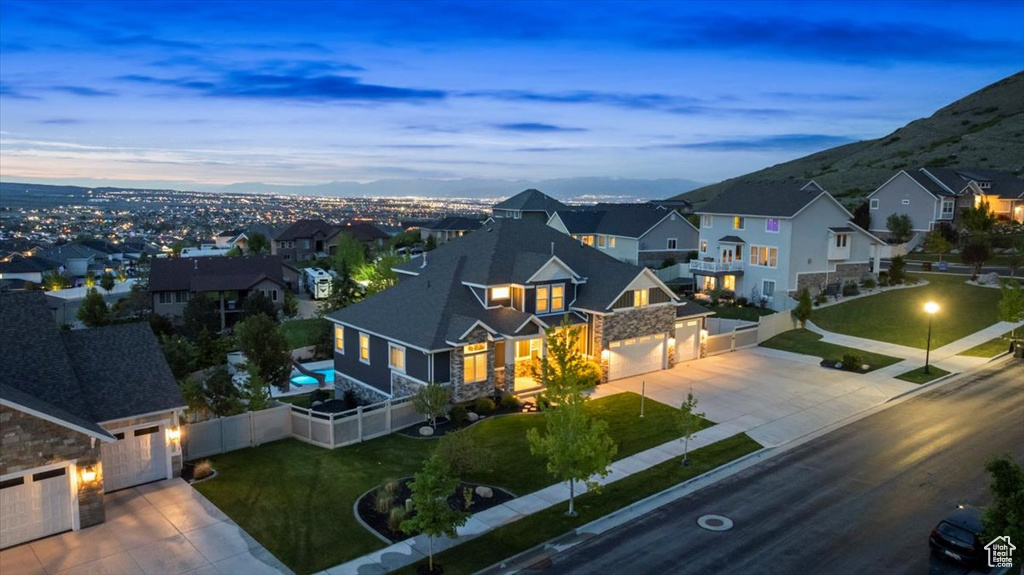 Aerial view at dusk of a residential view and a mountain view