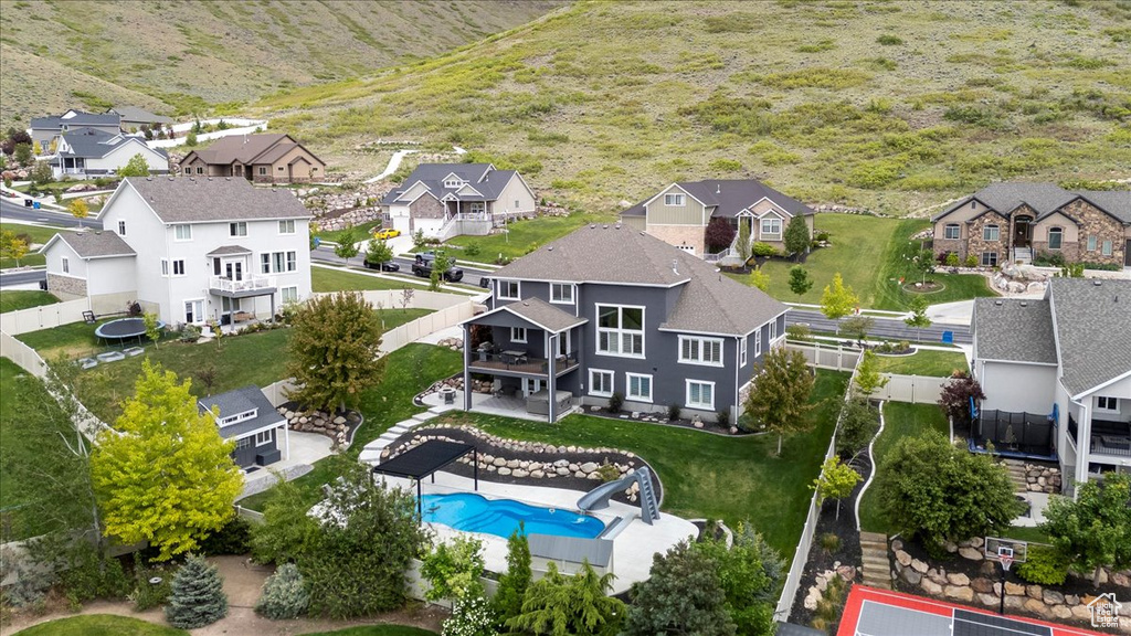 Aerial perspective of suburban area with a pool area