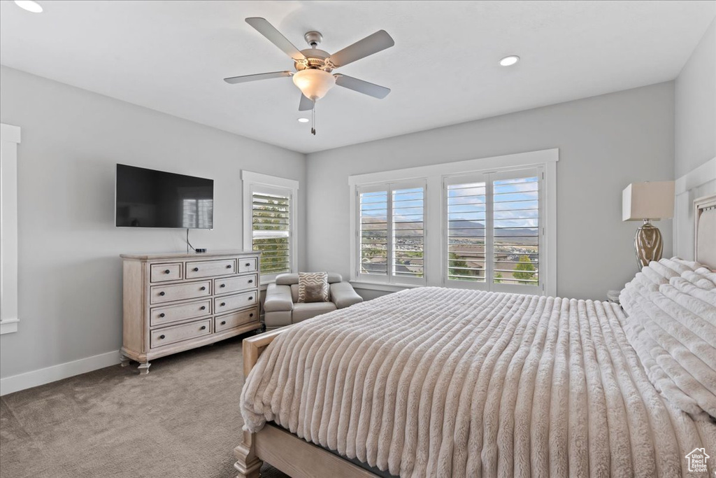 Carpeted bedroom with baseboards, recessed lighting, and ceiling fan