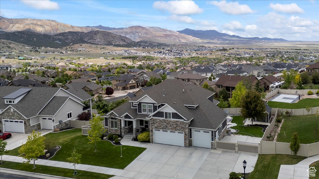 Aerial view of residential area featuring a mountain backdrop