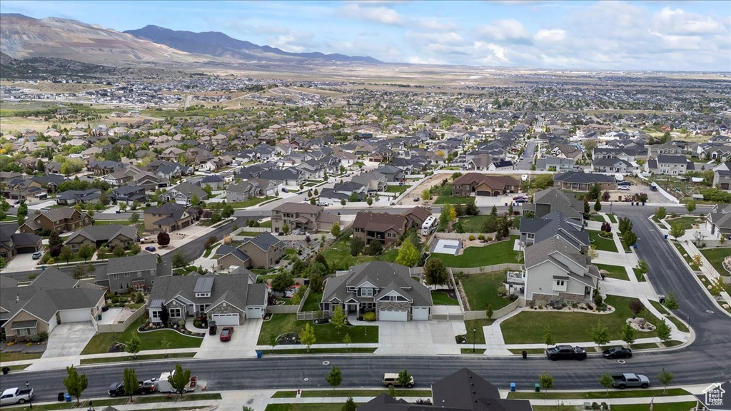 View of property location featuring nearby suburban area and a mountainous background