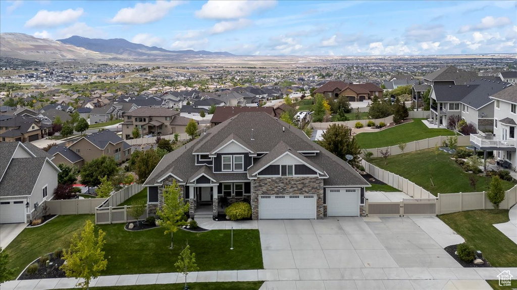Aerial view of residential area featuring mountains