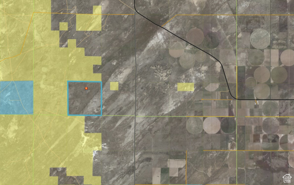 Aerial overview of property\'s location with property parcel outlined
