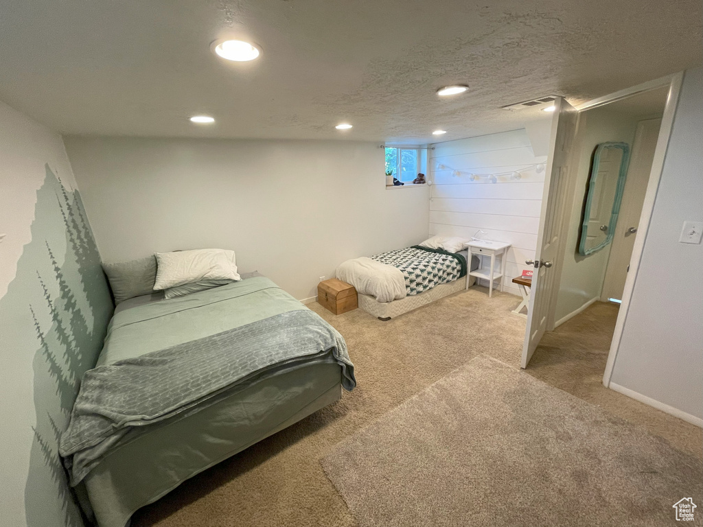 Bedroom with carpet flooring, recessed lighting, and baseboards