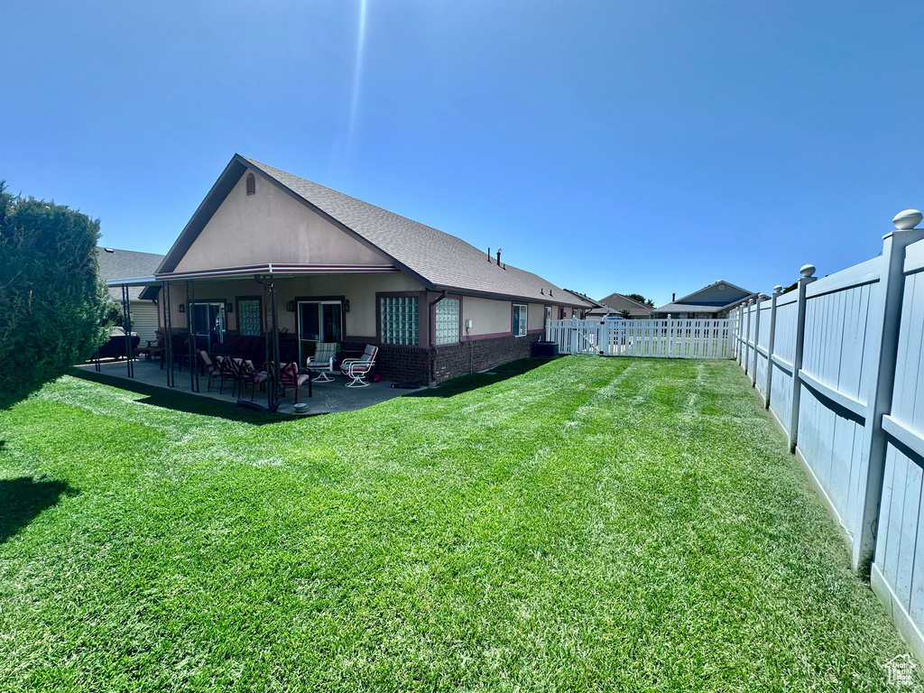 Rear view of property with a patio