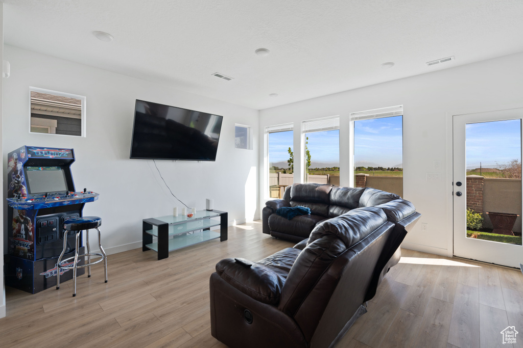 Living room featuring wood finished floors and baseboards
