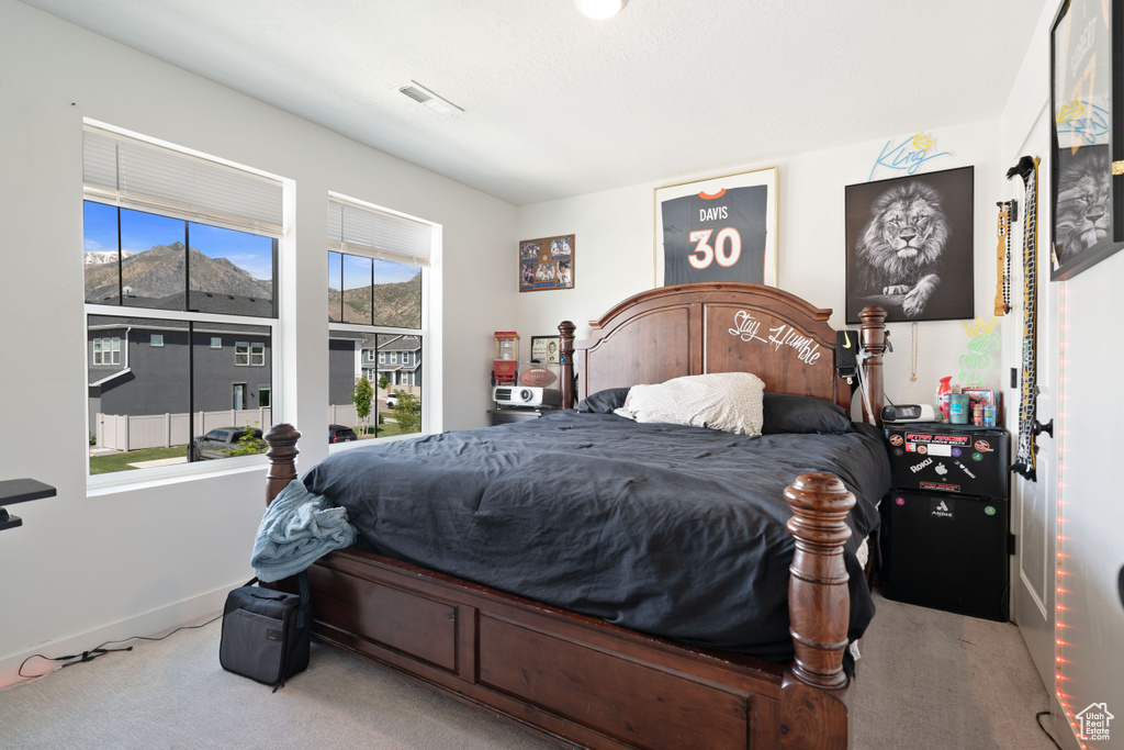 Carpeted bedroom with baseboards