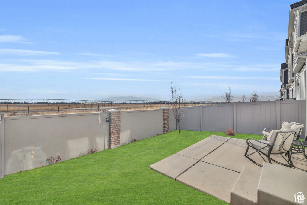 View of yard with a patio area