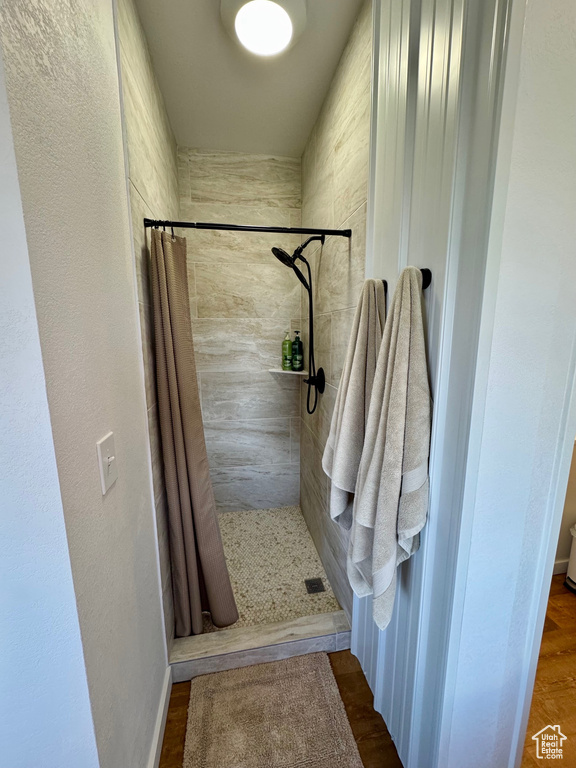 Bathroom featuring a shower stall