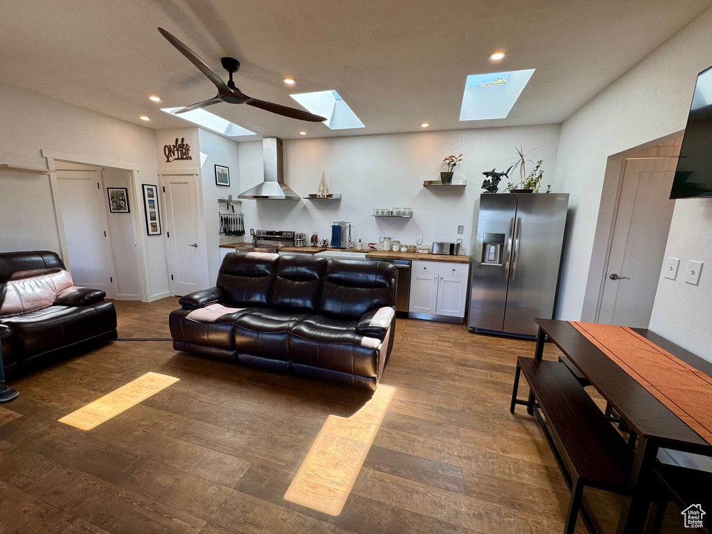 Living area featuring wood finished floors and recessed lighting