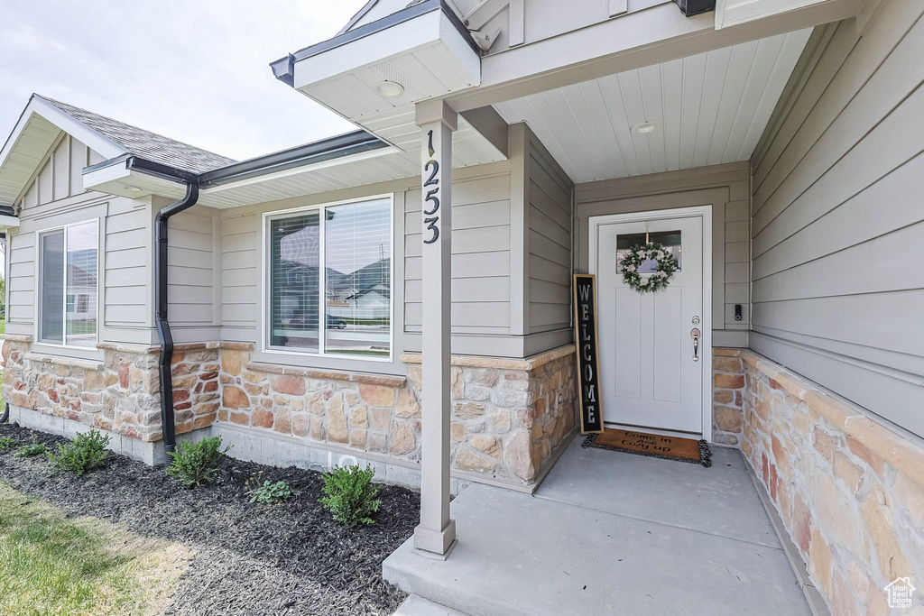 View of exterior entry with stone siding